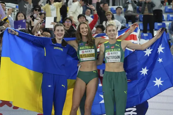 Maguchikh on the podium with a bronze medal