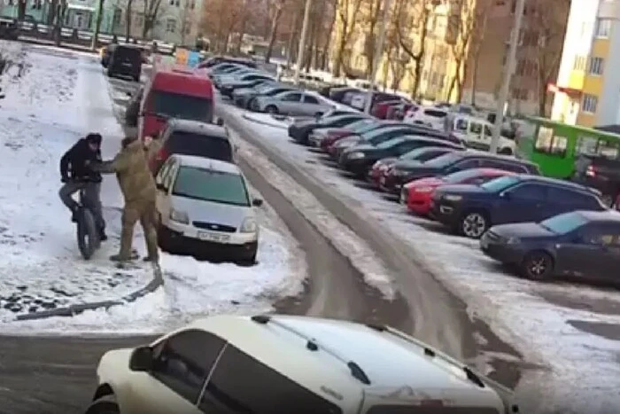 Serviceman throws a man off a bicycle