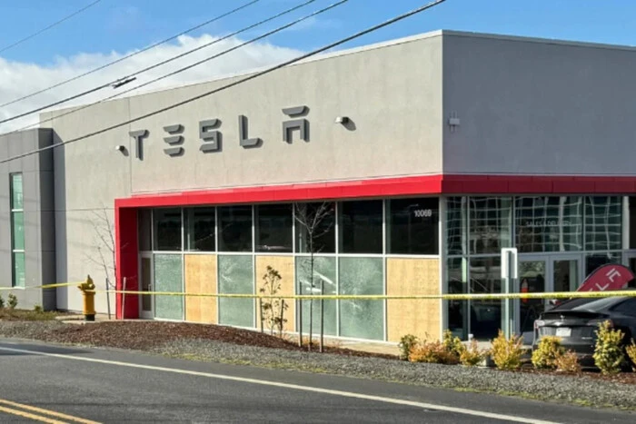 A man drove into a crowd of protesters near the Tesla center