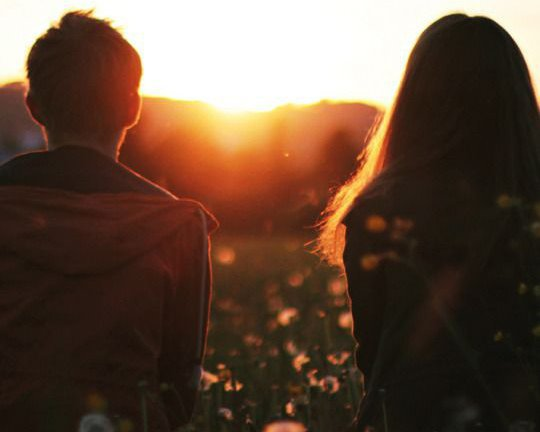 Couple sitting, holding hands