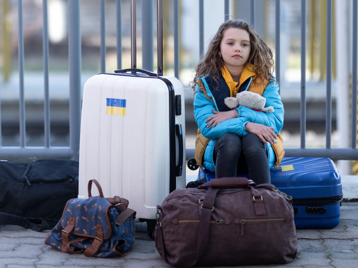 Image of a child with a passport and visa