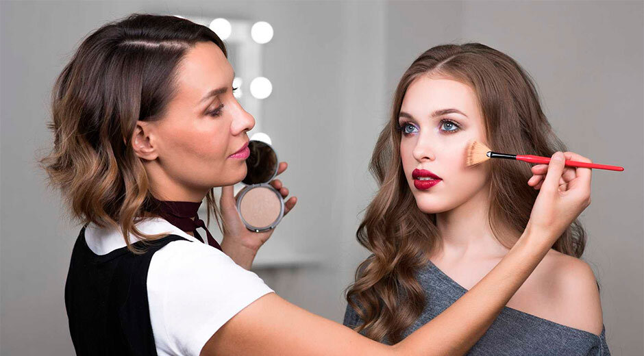 Image of a makeup artist with their client