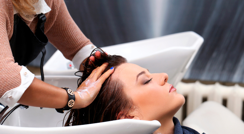 A man and a woman choose a shampoo