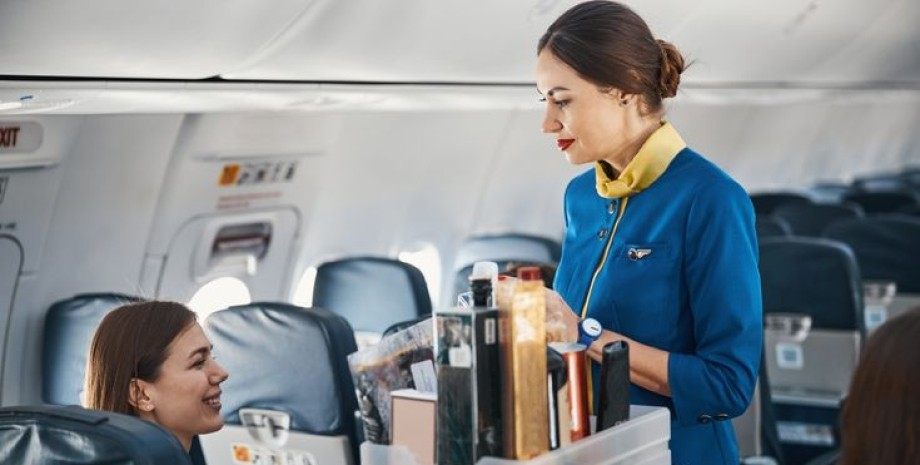 Girl in a flight attendant uniform with an airplane