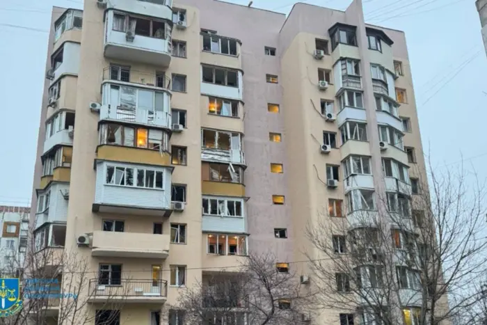 Damaged high-rise building and injured man