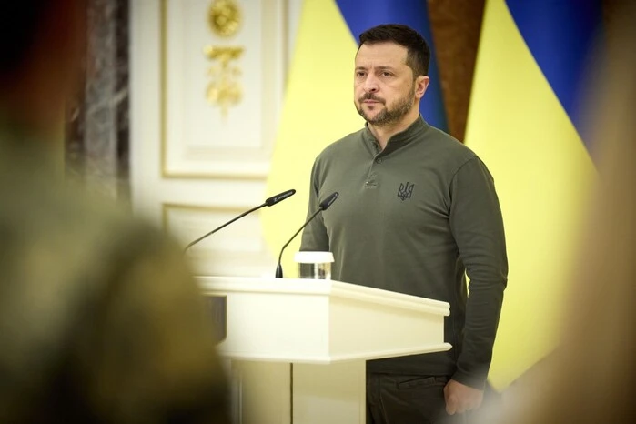 Zelensky against the background of the Ukrainian flag