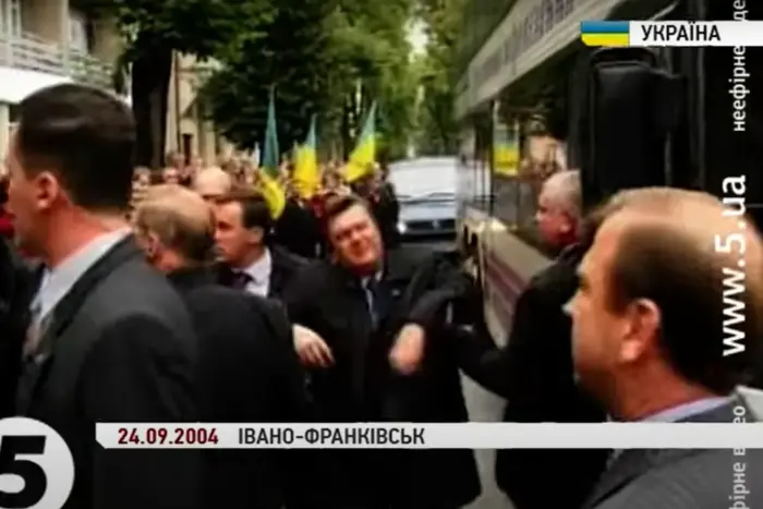 activist with egg on Yanukovych