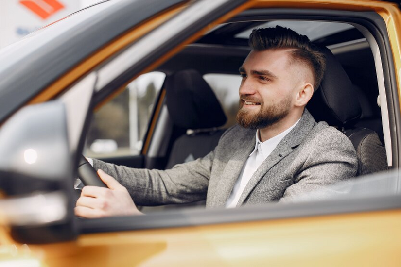 Driver on the road with a sign