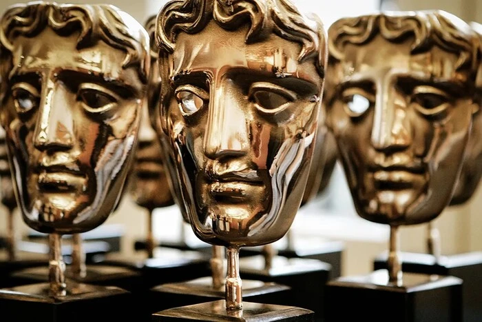 A photo of the golden BAFTA on the red carpet