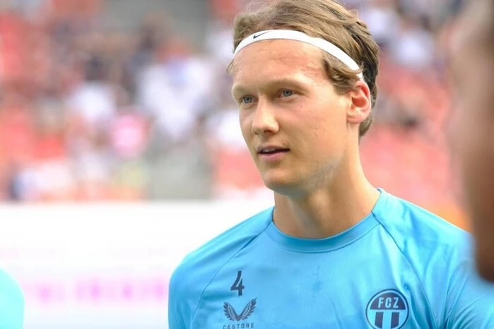 Footballer's meditative pose in the whirlwind of prayer