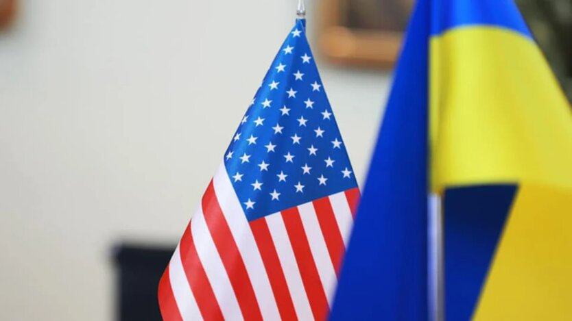 American flag and Ukrainian hryvnias