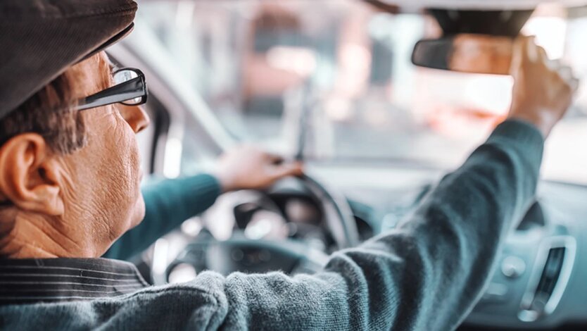 Elderly driver behind the wheel